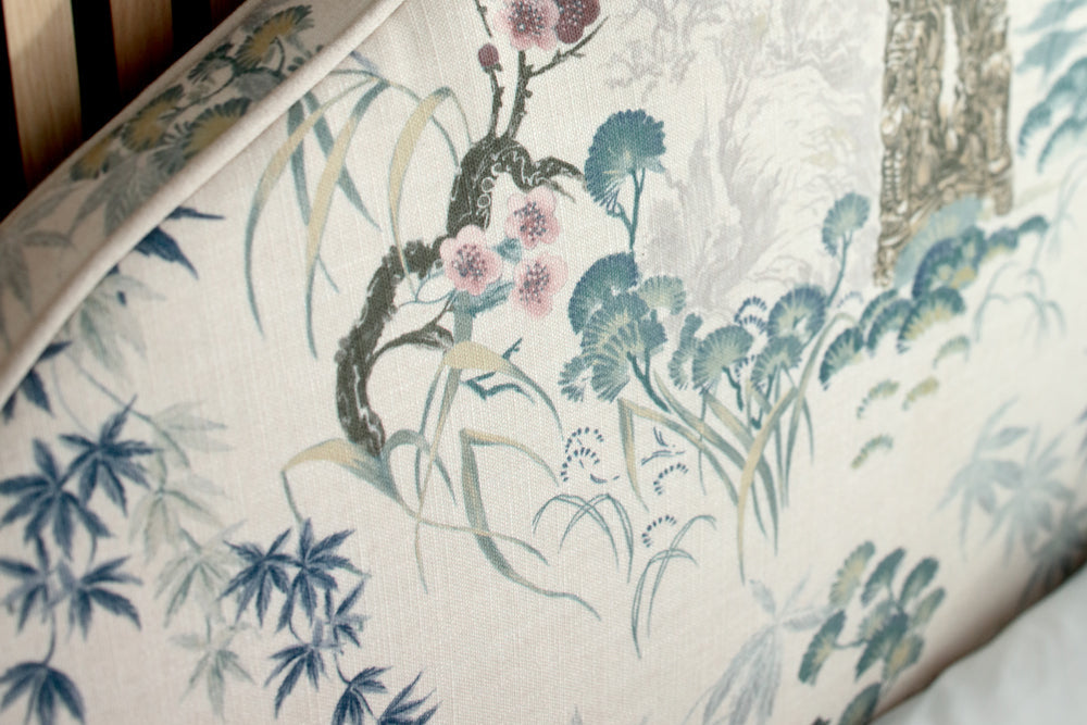 Floral and botanical patterned fabric with a wooden background